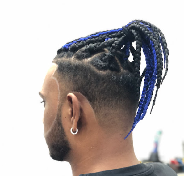 Braided hairstyle with blue-tinted braids and a shaved undercut